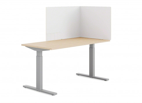 White Steelcase Corrugated Curtain on top of a Height-Adjustable light-wood desk.