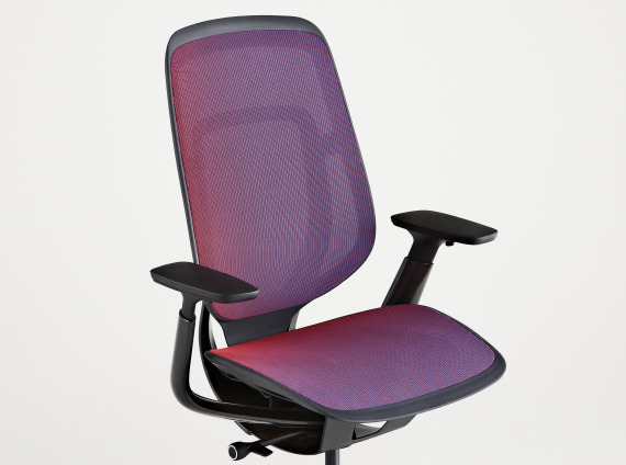 angled view of a Steelcase Karman chair with purple mesh