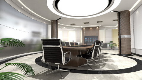 A modern office design featuring a conference room with integrated technology solutions
